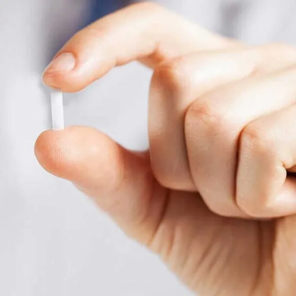 Close-up of hormone replacement therapy pellets from Encompass Wellness & Aesthetics.